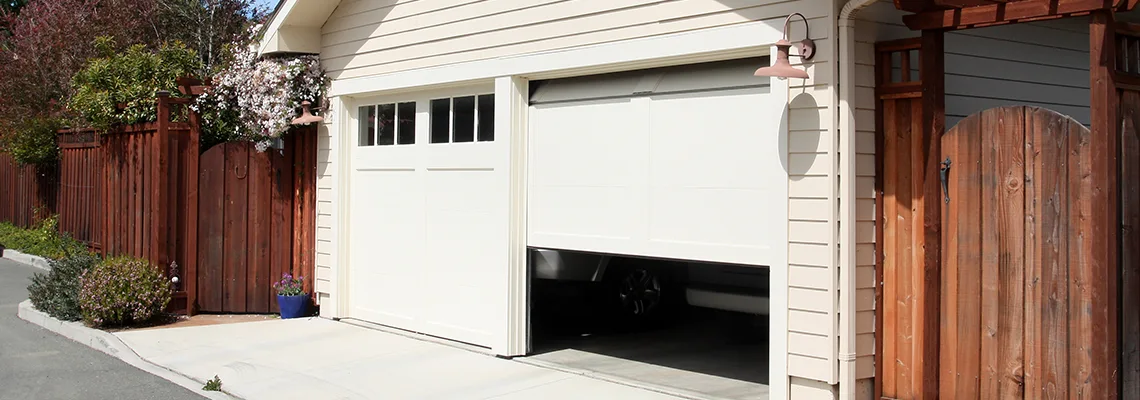 Fix Metal Garage Door Jerking in Oakville, Ontario